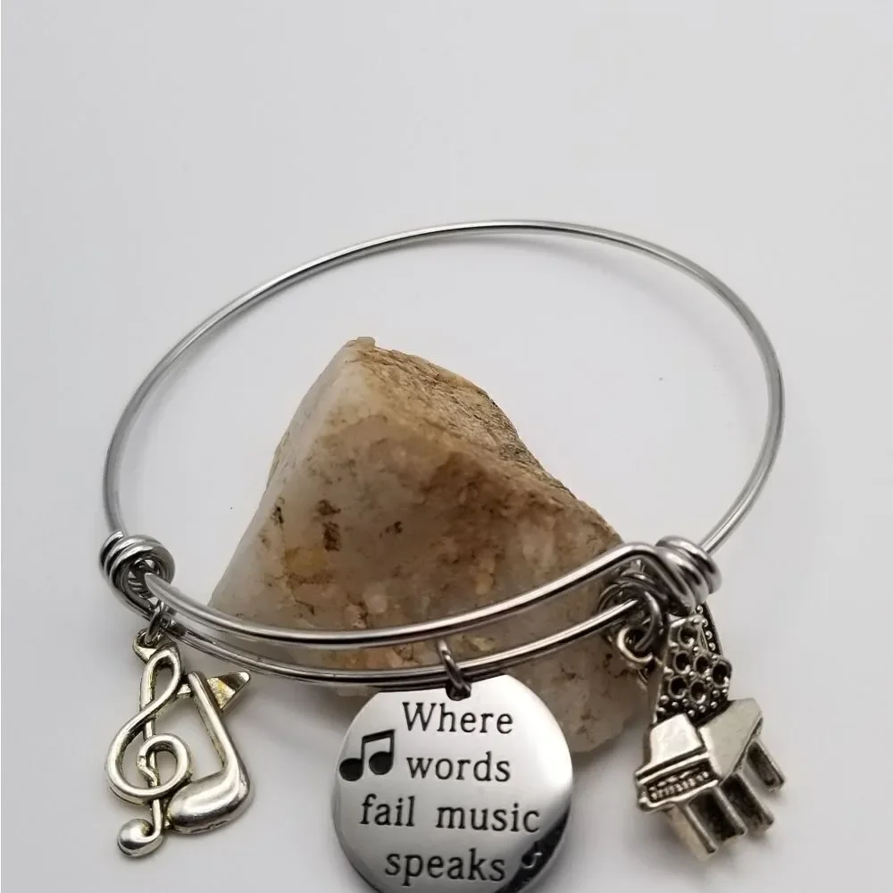 Where words fail music speaks silver tone bracelet quotations jewelry. B514